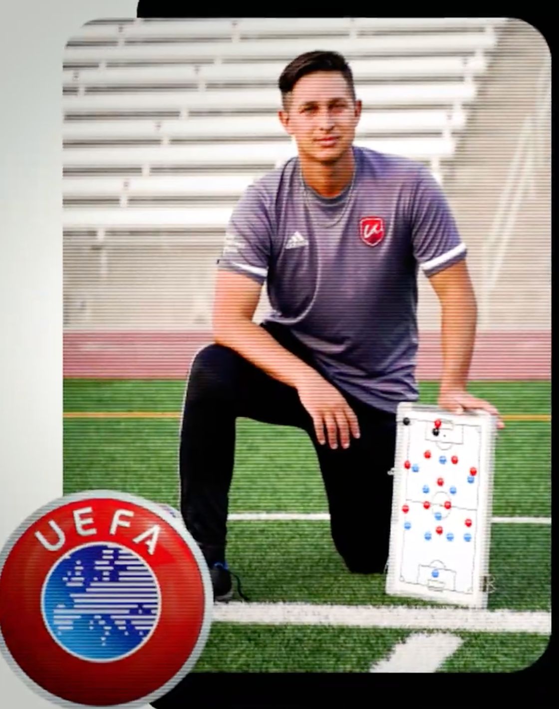 Keola Paredes, UEFA A licence holder, kneeling on the pitch with a tactics board